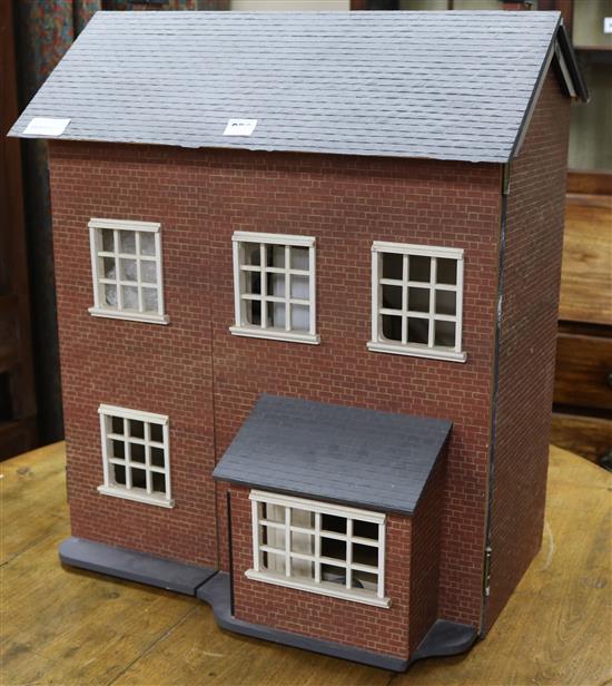 A modern dolls house with furniture W.56cm